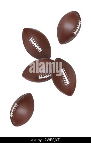 Beaucoup de balles de football américain volant sur fond blanc Banque D'Images
