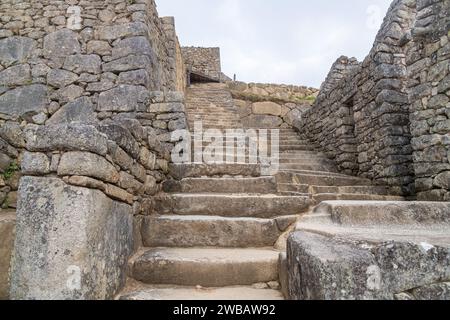 Structures de construction en pierre de granit vides au Machu Picchu au Pérou Banque D'Images