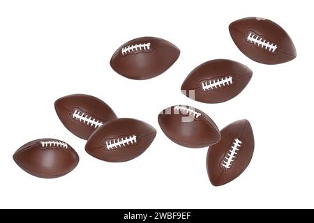 Beaucoup de balles de football américain volant sur fond blanc Banque D'Images