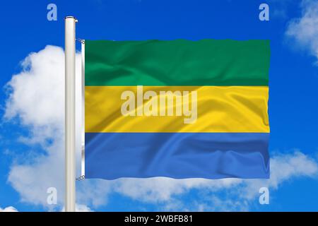 Drapeau national du Gabon devant les cumulus et le ciel bleu, Studio Banque D'Images