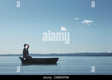 homme solitaire naviguant perdu dans un petit bateau au milieu de la mer à la recherche de lui-même Banque D'Images