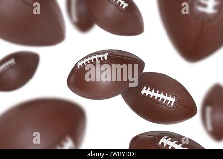 Beaucoup de balles de football américain volant sur fond blanc Banque D'Images