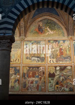 La création de la veille par Bartolo di Fredi, au sommet d'autres fresques murales représentant des scènes de l'ancien Testament, à la Collegiata di Santa Maria Assunta, San Gimignano Banque D'Images