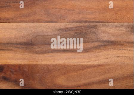 Surface d'une planche de bois d'olivier. Collées ensemble des planches séchées de bois d'olivier, coupées parallèlement à son axe longitudinal. Matériau très dur et résistant. Banque D'Images