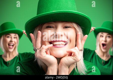 St Patrick's Day. Trois joyeuses filles portant des chapeaux leprechaun assortis célèbrent St. Patrick's Day en pulls verts. Ambiance festive sur un b vert vif Banque D'Images