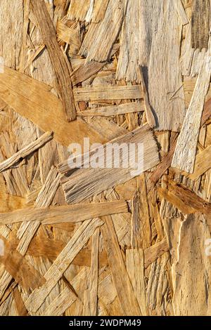 Texture de fond de panneau de particules de bois comprimé sans couture. Motif de fond en bois brun, contreplaqué ou panneau de bois orienté OSB Banque D'Images