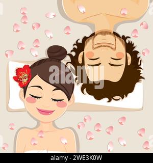 Couple sur le spa ayant un soin relaxant de fleurs couché sur le bureau de massage Banque D'Images