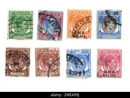 Timbres-poste vintage de Malaisie représentant un portrait du roi George VI isolé sur fond blanc. Banque D'Images