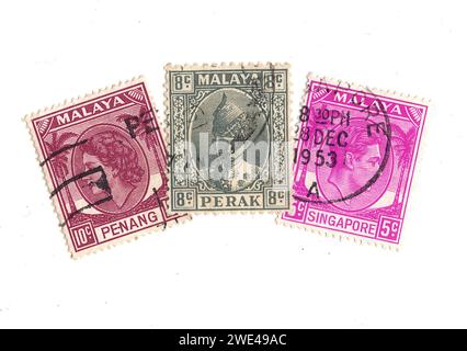 Timbres-poste vintage de Malaisie représentant un portrait du roi George VI isolé sur fond blanc. Banque D'Images