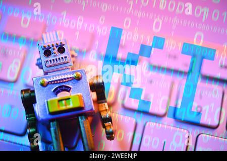 FOTOMONTAGE, Roboterfigur liegt auf einer Computertastatur mit Schriftzug KI, Symbolfoto künstliche Intelligenz *** PHOTOMONTAGE, figurine de robot posée sur un clavier d'ordinateur avec lettrage IA, photo symbolique intelligence artificielle Banque D'Images