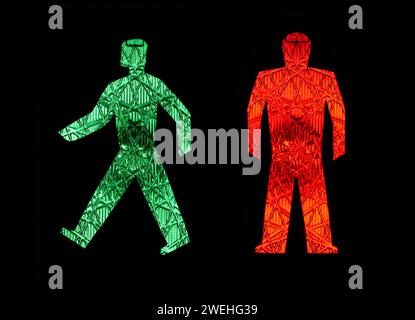 Un homme de feu vert s'éloigne d'un rouge stationnaire, pictogrammes, piéton Banque D'Images