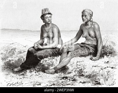 Dyak fille et femme forment long Wai. Kalimantan. Île de Bornéo, Indonésie. De Koutei à Banjarmasin, un voyage à travers Bornéo par Carl Bock (1849 - 1932) Banque D'Images