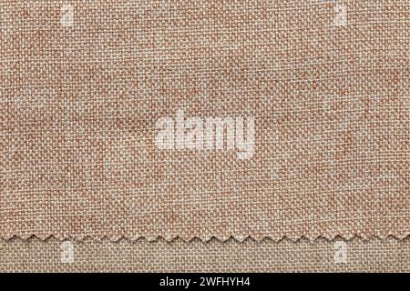 Image de fond - texture du tissu d'ameublement en deux nuances de beige. Banque D'Images