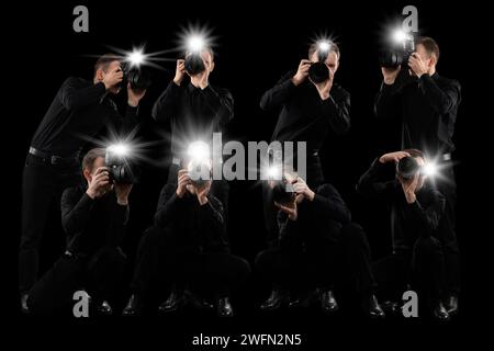 Groupe de photographes avec des appareils photo sur fond noir. Paparazzi prenant des photos avec des flashs Banque D'Images