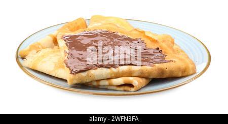 Crêpes savoureuses avec pâte de chocolat isolé sur blanc Banque D'Images