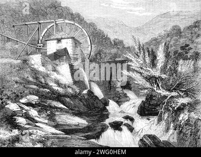 Les mines d'or Vigra, pays de Galles du Nord : The Crushing Mill, 1862. 'Les mines d'or Vigra sont situées dans une chaîne la plus pittoresque et montagneuse dans la paroisse de Llanabar, au nord de la rivière navigable Mowddach...in le comté de Merioneth. Les caractéristiques géologiques de ce district sont les roches cambriennes, recouvertes par les drapeaux lingula du Silurien inférieur. Ces roches sont grossières, grises verdâtres. Les drapeaux lingula sont principalement des lits de slatées, plus ou moins arénacées, et interstratifiés avec des couches de grès. Les Cambriens et les Siluriens sont fréquemment pénétrés par des et calcaires gris clair Banque D'Images