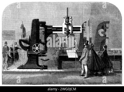 L'exposition internationale - radiale auto-active de Whitworth, perceuse, etc., 1862. La collection d'outils rencontrée pour la première fois en entrant dans l'annexe est celle de M. Whitworth. Il comprend des spécimens de toutes les principales machines construites dans ses œuvres à Manchester : ils sont de la plus haute classe en ce qui concerne la fabrication et le design. Aucun homme n'a fait autant pour perfectionner l'art de la fabrication d'outils que M. Whitworth ; les productions de ses ateliers sont célébrées partout dans le monde... notre Illustration représente un groupe des machines dans l'exposition de M. Whitworth : le principal est un grand récemment Banque D'Images