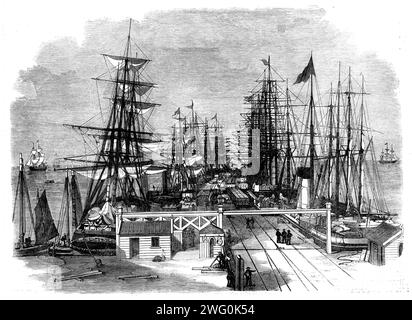 Jetée de la Melbourne and Hobson's Bay Railway Company à Sandridge, près de Melbourne, Australie, 1862. En 1853-4, '... Le coût du transit, par les briquets de la navigation dans la baie, via la route sinueuse de la rivière Yarra Yarra, vers les quais de Melbourne était en moyenne à partir des années 45 à 35s. Par tonne, mais, à l'ouverture de cette jetée de chemin de fer pour le trafic, ces taux ont été réduits à un septième... il est construit du meilleur bois dur colonial, soutenu par des piles de gomme bleue... la jetée est éclairée au gaz, et l'eau... est posée sur toute la longueur... à partir de la période de son ouverture... jusqu'à un demi-moulin Banque D'Images