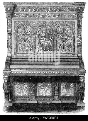 L'exposition internationale : pianoforte de MM. Allison, de Wardour-Street, 1862. '...un très beau...grand cottage ou piano semi-armoire, richement sculpté en chêne non poli. La conception - dont le style est en partie élisabéthain, bien que de l'époque de Charles I. - Est emblématique et illustratif de la musique. Le clavier est soutenu par des figures d'anges agenouillées, jouant sur la harpe. Les côtés... sont lambrissés, et contiennent des bustes des musiciens les plus célèbres mentionnés dans l'écriture... et des portraits en médaillon des grands compositeurs... la partie supérieure de la façade est soutenue de chaque côté Banque D'Images