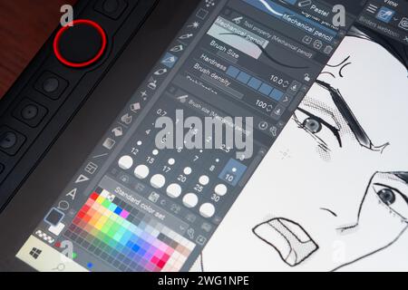 Dessiner un personnage de bande dessinée sur une tablette numérique, 1 février 2024 Banque D'Images