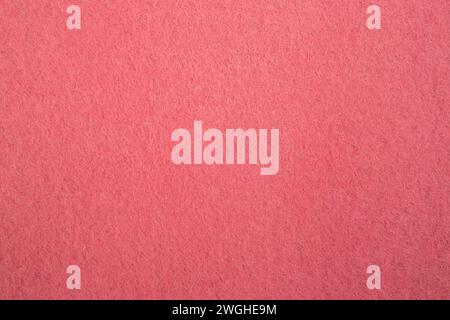 Texture de tissu feutre avec fibre visible, fond de motif abstrait de couleur rose pêche, Banque D'Images