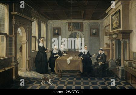 Cinq dames dans un intérieur, Dirck van Delen (attribué à), c. 1630 - c. 1652 peinture intérieur avec cinq femmes assis et debout autour d'une table. Quelques peintures encadrées et gravures sur les murs. Au premier plan un chien, à droite un klavechord. panneau. Peinture à l'huile (peinture) personne historique anonyme représentée - BB - femme. chambres communes Banque D'Images