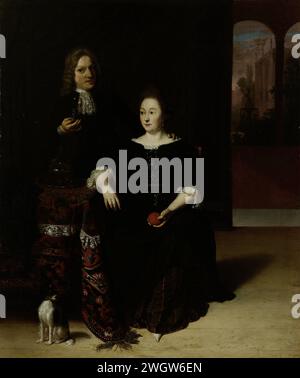 Portrait d'une femme et d'un homme dans un intérieur, Matthias Wulfraet, 1694 peinture Portrait d'une dame assise et d'un gentleman debout dans un intérieur à une table couverte d'un tapis persan avec une carafe en verre. L'homme a un Roemer avec du vin à la main, la femme une pomme ou une orange. A la table il y a un chien, à droite en arrière-plan un aperçu d'un jardin avec une fontaine. toile. chien de peinture à l'huile (peinture). mariage, couple marié, 'matrimonium'. intérieur de la maison Banque D'Images