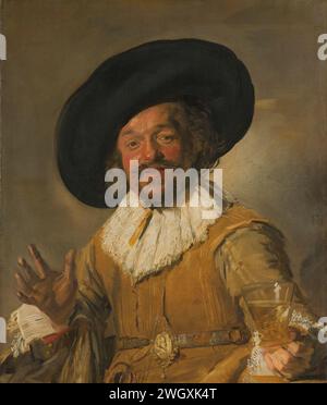 Un milicien tenant un Berkemeyer, connu comme le «Joyeux buveur», c. 1628 - c. 1630 peignant le joyeux buveur. Homme souriant avec barbe et grand chapeau noir, demi-fuite, avec un bouleau dans la main gauche et la main droite soulevée. Un médaillon sur une chaîne autour du cou. toile. peinture à l'huile (peinture) verre, rummer. coiffure : chapeau (+ vêtements pour hommes). guerre ; affaires militaires (+ soldat citoyen, garde civile, milice citoyenne). boire. riant Banque D'Images