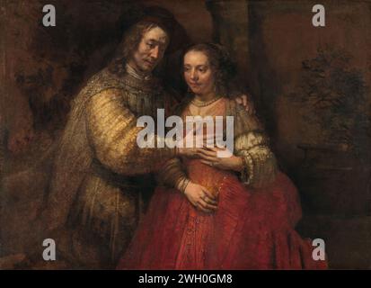 Isaac et rebecca, connu comme «la mariée juive», rembardt van rijn, c. 1665 - c. 1669 peinture Portrait d'une paire comme Isaac et Rebecca ou d'autres figures de l'ancien Testament, connu sous le titre «la mariée juive» ou «la mariée juive». L'homme pose sa main droite sur la poitrine de la femme, le bras gauche sur les épaules. La femme pose sa main gauche sur la main de l'homme, la main droite devant le ventre. Le couple est représenté debout, aux genoux, devant un mur. doek : lin (matière). Peinture à l'huile (peinture) mariage d'Isaac et Rebekah. mariage, couple marié, 'matrimonium' Banque D'Images