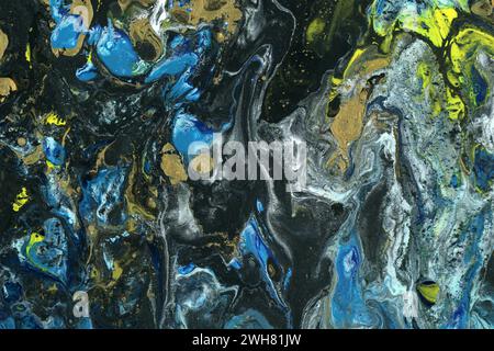 Couleurs mélangées. Coulage acrylique et fluide Art. Effet marbré tourbillonnant où la peinture acrylique liquide est versée sur un fond de toile. Banque D'Images