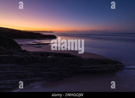Lever de soleil sur Tregantle Beach Banque D'Images