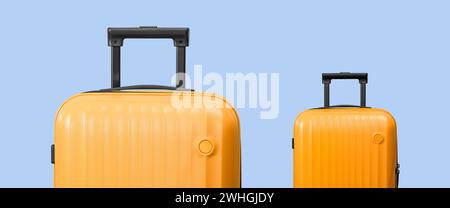 Valises jaunes élégantes sur fond bleu, concept de voyage minimal. Vacances de saison d'été ou d'hiver. Concept Time to Travel Banque D'Images