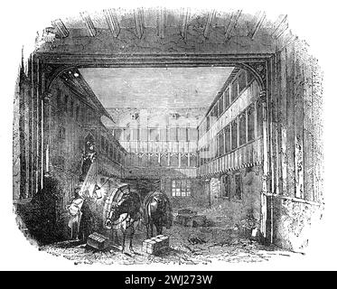 An Inn Yard i London. XVIe ou XVIIe siècle ; illustration en noir et blanc de la vieille Angleterre publiée par James Sangster en 1860. Banque D'Images