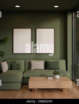 Le design intérieur d'un salon moderne de couleur verte dispose d'un canapé vert confortable, d'une table basse en bois, de parquet et de cadres maquette sur un gr Banque D'Images