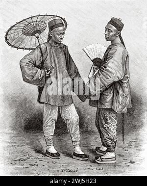 Employé chinois à Nam Dinh vêtu de vêtements traditionnels avec parapluie et ventilateur. Tonkin, Indochine française. Vietnam, Asie. Trente mois au Tonkin 1885 par le Docteur Charles Edouard Hocquard (1853 - 1911) le Tour du monde 1890 Banque D'Images