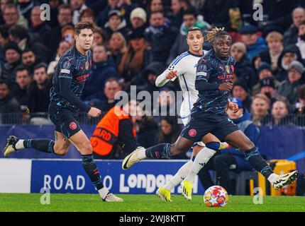 Jeremy Doku de Manchester City et John Stones et Elias Achouri de FCK lors du match de la 16e manche de l'UEFA Champions League entre le FC Copenhague et Manchester City lors de la 1ère manche à Parken, Copenhague, mardi 13 février 2024. (Photo : Liselotte Sabroe/Ritzau Scanpix) Banque D'Images