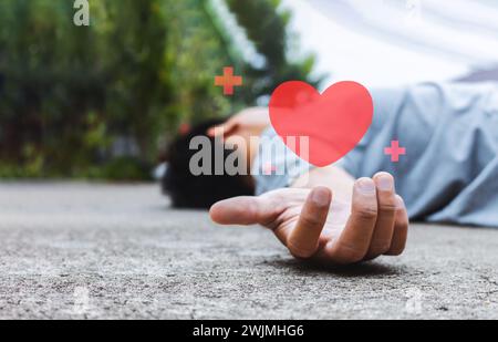 homme tombant sur la route à cause de l'accident vasculaire cérébral ou accident vasculaire cérébral avec flou et sur la lumière en arrière-plan Banque D'Images