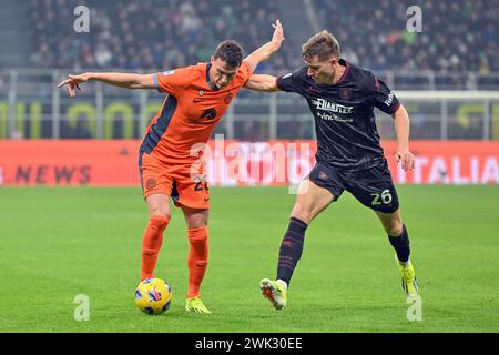 Milan, Italie. 16 février 2024. Benjamin Pavard (28) de l'Inter et Toma Basic (26) de Salernitana vus lors du match de Serie A entre Inter et Salernitana à Giuseppe Meazza à Milan. (Crédit photo : Gonzales photo - Tommaso Fimiano). Banque D'Images