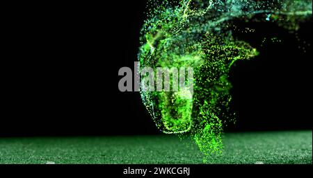 Image de particules vertes brillantes se déplaçant sur un ballon de rugby sur le terrain Banque D'Images