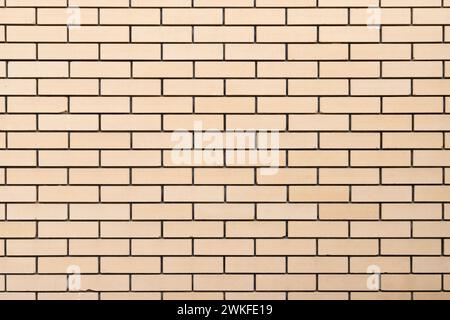 Mur de briques jaunes, vue de face, texture de photo de fond Banque D'Images