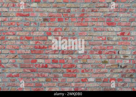 Vieux fond de texture de mur de briques peintes en rouge, élément architectural, maçonnerie, brique. Toile de fond, fond d'écran. Banque D'Images