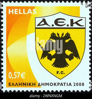 GRÈCE - VERS 2008 : un timbre imprimé en Grèce à partir de l'émission 'Soccer Team Emblems' montre l'emblème 'F.C. AEK Athens' Banque D'Images