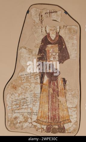 Cette peinture murale du XIIe au XIIIe siècle représente Saint Épiphane, évêque de Salamine-Konstanie, illustrant l'art religieux médiéval et l'iconographie en Pologne. Banque D'Images