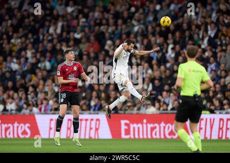 Madrid, Espagne. 10 mars 2024. Jose Ignacio Fernandez Iglesias, connu sous le nom de Nacho Fernandez du Real Madrid CF (R) avec Jorgen Strand Larsen du RC Celta de Vigo (l) en action lors du match de football de la semaine la Liga 28 entre le Real Madrid CF et le RC Celta de Vigo au stade Santiago Bernabeu. Score final : Real Madrid CF-RC Celta de Vigo 4-0 (photo Federico Titone/SOPA images/SIPA USA) crédit : SIPA USA/Alamy Live News Banque D'Images