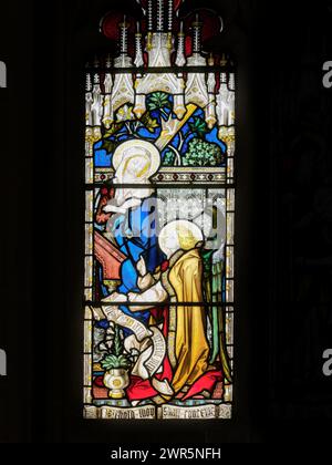 L'ange Gabriel dit à Marie qu'elle doit avoir un enfant nommé Jésus, illustration dans l'église de Sainte Marie majeure, l'église universitaire de Cambridge, en Angleterre. Banque D'Images