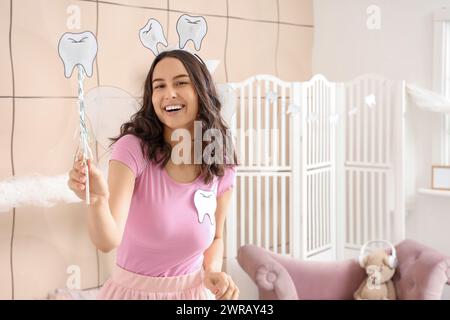 Fée des dents avec baguette dans la chambre des enfants Banque D'Images