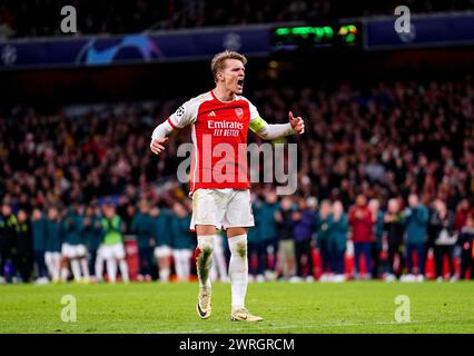 Martin Odegaard d'Arsenal célèbre après avoir marqué la première pénalité du tir de pénalité lors de la manche 16 de l'UEFA Champions League, match de deuxième manche à l'Emirates Stadium de Londres. Date de la photo : mardi 12 mars 2024. Banque D'Images