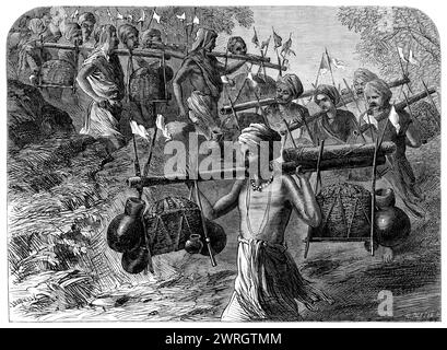 Pèlerins du Gange passant devant un ghaut, [Inde], 1864. « La route entre Allahabad et Benares est littéralement bondée de pèlerins vers la rivière sacrée... ils viennent ou vont vers toutes les parties de l'Inde - Thibet, et même Birmah. Ici et là, les foules sont si denses que c’est avec difficulté que vous vous frayez un chemin à travers elles. Notre illustration montre un groupe de vendeurs d'eau sacrée passant un ghaut, ou la pente raide et déchiquetée menant à un gué de l'un des nombreux nullahs, ou ruisseaux de montagne qui croisent leur route vers les districts périphériques, où ils disposeront de ce qu'on appelle sacré Banque D'Images