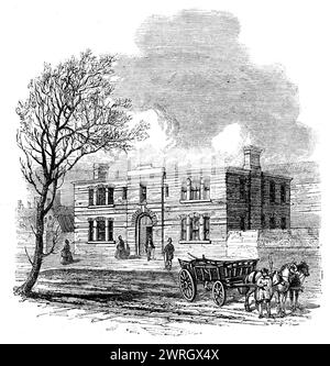 Bureaux rattachés au Hall agricole, Islington, 1862. Site du salon du bétail et des outils du Smithfield Club. Le hall '...a des entrées de tous les côtés. Sa position centrale, en ce qui concerne les différents terminus ferroviaires (avec tous lesquels il est en communication directe par le biais de la Nouvelle-route) le rend bien adapté aux fins auxquelles il est destiné... la façade occidentale... est le principal; et ici, il y a deux hautes tours et une entrée de chariot audacieuse. La construction est en brique jaune, avec des bandes et des arches de briques rouges. À l'extrémité est, presque face à Islington-Green, se trouve un Ar Banque D'Images