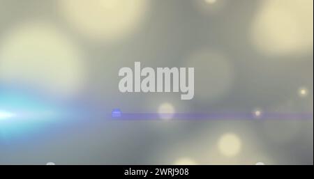 Image d'un projecteur bleu avec un reflet de lentille sur des taches de lumière bokeh sur gris Banque D'Images